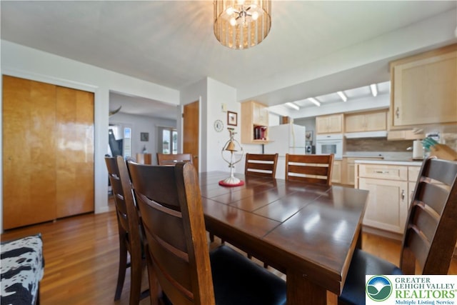 275 E Thomas Ave, Hellertown Boro, PA 18055 - dining room with light wood-type flooring and a chandelier