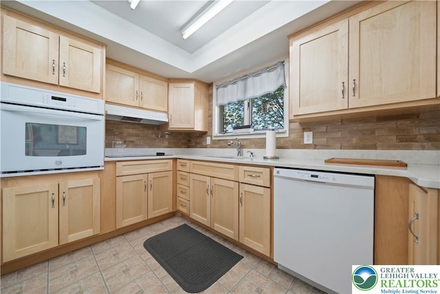 275 E Thomas Ave, Hellertown Boro, PA 18055 - kitchen with white appliances, light brown cabinets, under cabinet range hood, and backsplash
