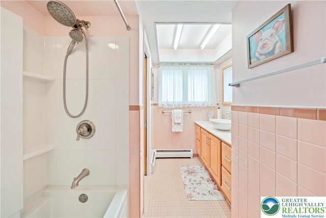 275 E Thomas Ave, Hellertown Boro, PA 18055 - full bathroom featuring tile walls, tile patterned floors, bathtub / shower combination, vanity, and baseboard heating