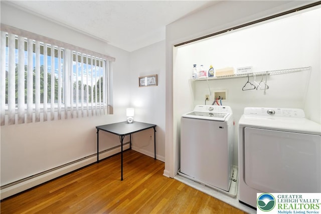275 E Thomas Ave, Hellertown Boro, PA 18055 - laundry room with washing machine and clothes dryer, a baseboard radiator, and light wood-style floors