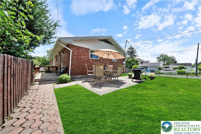 275 E Thomas Ave, Hellertown Boro, PA 18055 - rear view of house with brick siding, a patio, and a fenced backyard