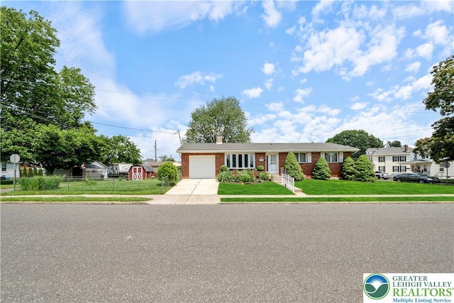275 E Thomas Ave, Hellertown Boro, PA 18055 - ranch-style home with driveway, a garage, brick siding, a front yard, and a chimney