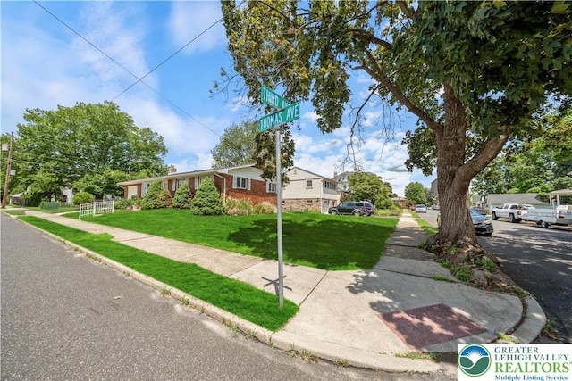 275 E Thomas Ave, Hellertown Boro, PA 18055 - view of front facade with a front yard and brick siding