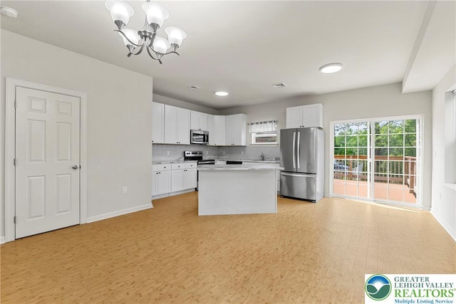 273 W Fairview St W, Bethlehem City, PA 18018 - kitchen with stainless steel appliances, a chandelier, white cabinets, and light countertops
