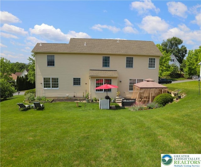 3104 Peacock Dr, Bethlehem Twp, PA 18020 - rear view of property with a gazebo and a lawn