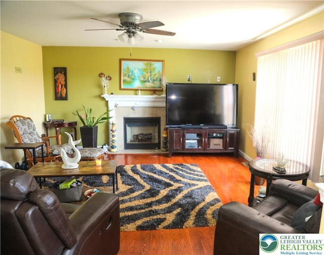 3104 Peacock Dr, Bethlehem Twp, PA 18020 - living room featuring a ceiling fan, wood finished floors, and a tile fireplace