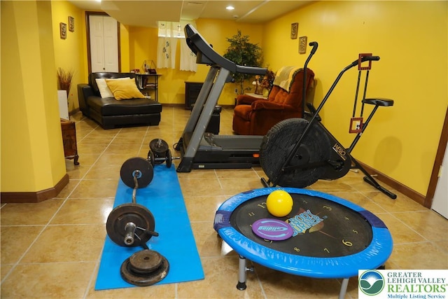 3104 Peacock Dr, Bethlehem Twp, PA 18020 - exercise room with tile patterned flooring and baseboards