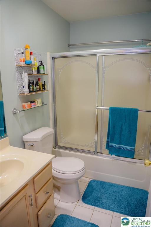 3104 Peacock Dr, Bethlehem Twp, PA 18020 - bathroom featuring vanity, bath / shower combo with glass door, and tile patterned floors
