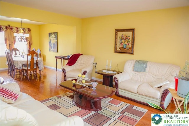 3104 Peacock Dr, Bethlehem Twp, PA 18020 - living room with wood finished floors and a chandelier