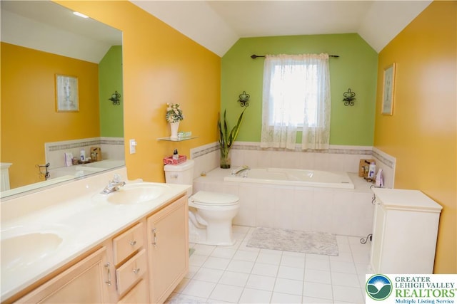 3104 Peacock Dr, Bethlehem Twp, PA 18020 - bathroom with lofted ceiling, a garden tub, tile patterned floors, and double vanity