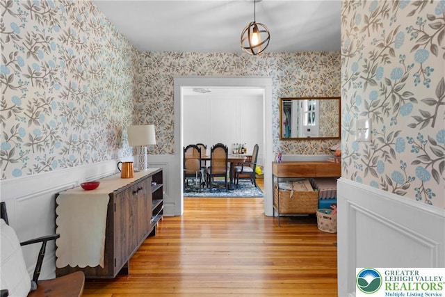 827 Wilbur St, Easton, PA 18042 - hall featuring wallpapered walls, a wainscoted wall, and light wood-style floors