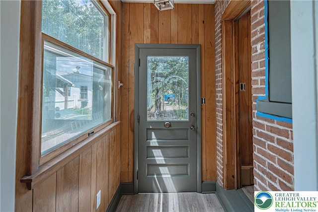 622 N Jefferson St, Allentown City, PA 18102 - doorway to outside with wooden walls and wood finished floors