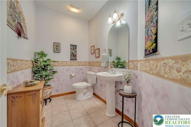 101 Blackstone Dr, Bushkill Twp, PA 18091 - bathroom with a wainscoted wall and tile patterned flooring