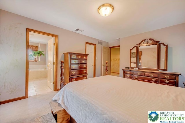 101 Blackstone Dr, Bushkill Twp, PA 18091 - bedroom featuring ensuite bathroom and light colored carpet