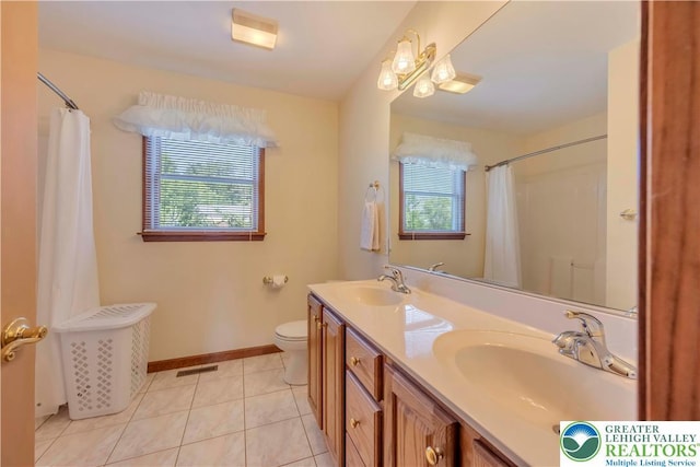 101 Blackstone Dr, Bushkill Twp, PA 18091 - bathroom with healthy amount of natural light, double vanity, tile patterned floors, and a shower with curtain