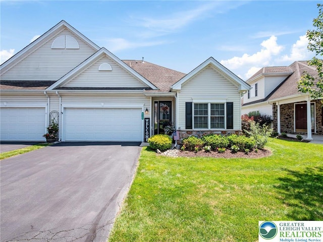4112 Pine Hurst Dr, Allen Twp, PA 18067 - view of front facade with asphalt driveway, a front lawn, an attached garage, and stone siding