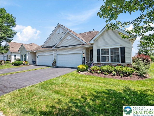 4112 Pine Hurst Dr, Allen Twp, PA 18067 - view of front facade with an attached garage, driveway, a front lawn, and stone siding