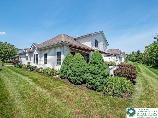 4112 Pine Hurst Dr, Allen Twp, PA 18067 - view of side of home with a yard and a shingled roof