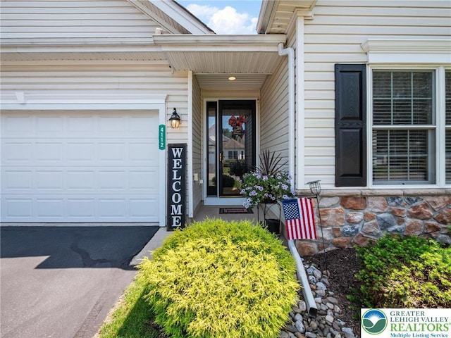 4112 Pine Hurst Dr, Allen Twp, PA 18067 - view of exterior entry with driveway and a garage
