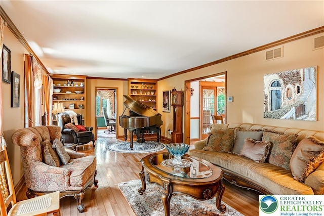 530 Station Rd, Richland Twp, PA 18951 - living room featuring crown molding, hardwood / wood-style flooring, and built in shelves