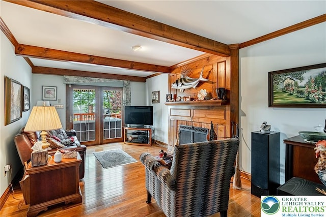 530 Station Rd, Richland Twp, PA 18951 - living room with beam ceiling, a fireplace, and wood finished floors