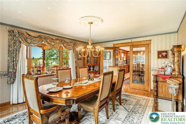 530 Station Rd, Richland Twp, PA 18951 - dining area featuring a chandelier, wallpapered walls, light wood-type flooring, and ornamental molding