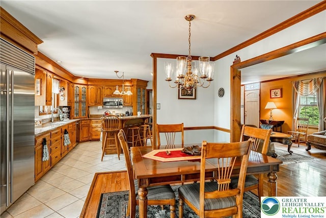 530 Station Rd, Richland Twp, PA 18951 - dining room featuring a chandelier, ornamental molding, and light tile patterned flooring