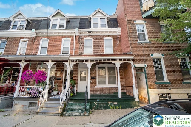 438 N 9th St, Allentown City, PA 18102 - multi unit property with brick siding, mansard roof, and covered porch