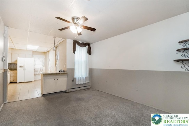 438 N 9th St, Allentown City, PA 18102 - unfurnished living room with ceiling fan and a baseboard heating unit