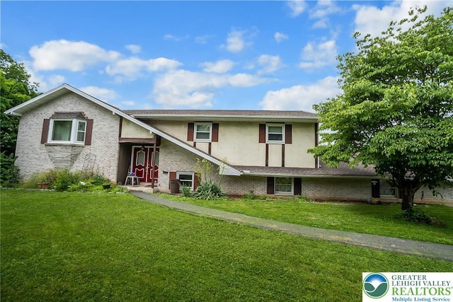 2057 Grove St, South Whitehall Twp, PA 18104 - view of front of property with stucco siding, brick siding, and a front yard