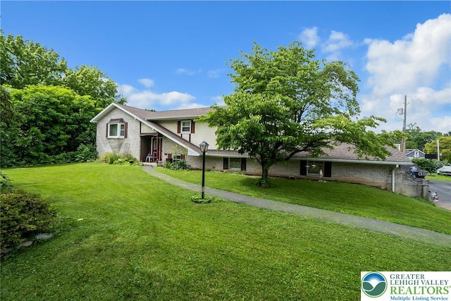 2057 Grove St, South Whitehall Twp, PA 18104 - traditional-style home with a front lawn, brick siding, and stucco siding