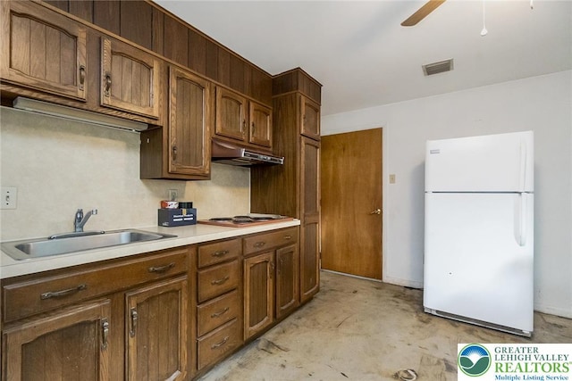 2057 Grove St, South Whitehall Twp, PA 18104 - kitchen featuring freestanding refrigerator, under cabinet range hood, a ceiling fan, light countertops, and unfinished concrete floors