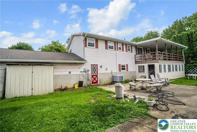 2057 Grove St, South Whitehall Twp, PA 18104 - back of property featuring a patio area, a yard, and a balcony