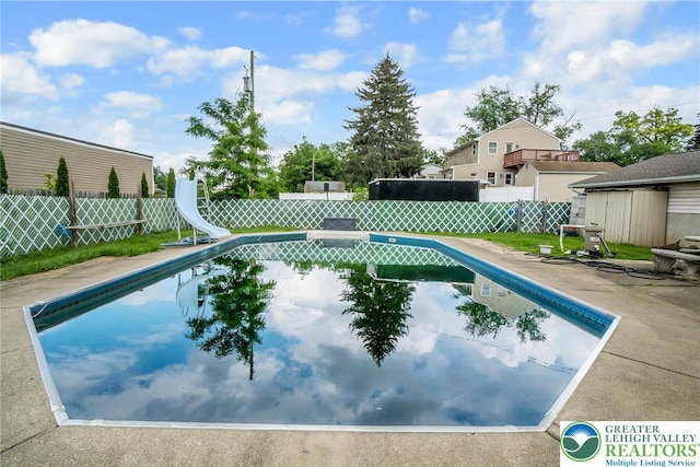 2057 Grove St, South Whitehall Twp, PA 18104 - view of pool featuring a water slide, a fenced backyard, and a patio area