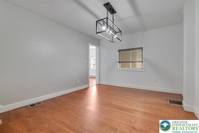 916 E Susquehanna St, Salisbury Twp, PA 18103 - unfurnished dining area with light wood-style flooring and baseboards