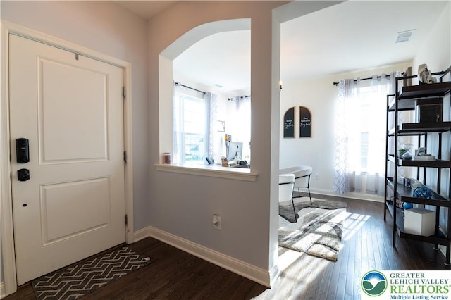 420 Rinaldi Ln, Forks Twp, PA 18040 - entryway featuring dark wood finished floors and arched walkways