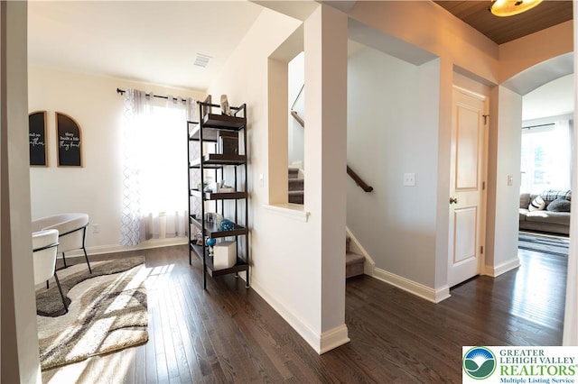 420 Rinaldi Ln, Forks Twp, PA 18040 - hall with arched walkways, dark wood finished floors, and stairs
