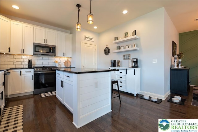 420 Rinaldi Ln, Forks Twp, PA 18040 - kitchen with stainless steel appliances, dark wood-style flooring, dark countertops, and recessed lighting