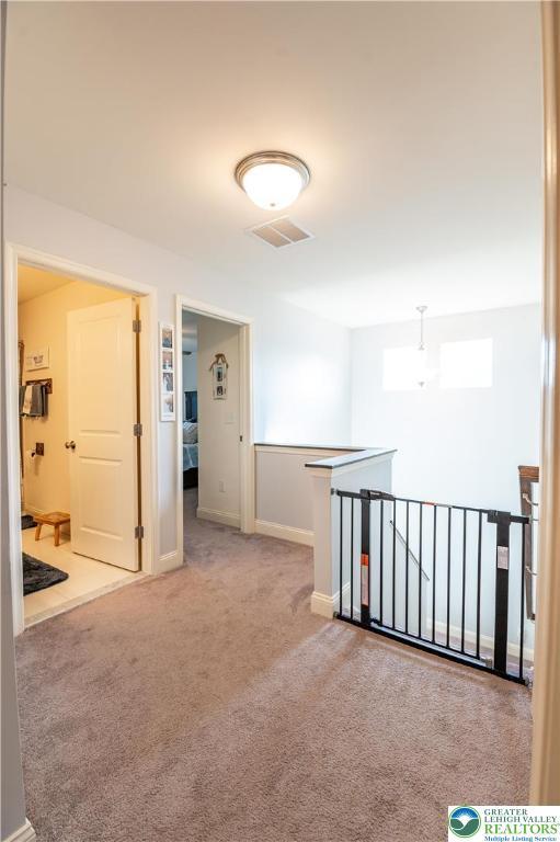 420 Rinaldi Ln, Forks Twp, PA 18040 - corridor featuring an upstairs landing and carpet floors