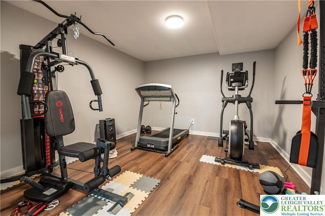420 Rinaldi Ln, Forks Twp, PA 18040 - workout area with baseboards and wood finished floors