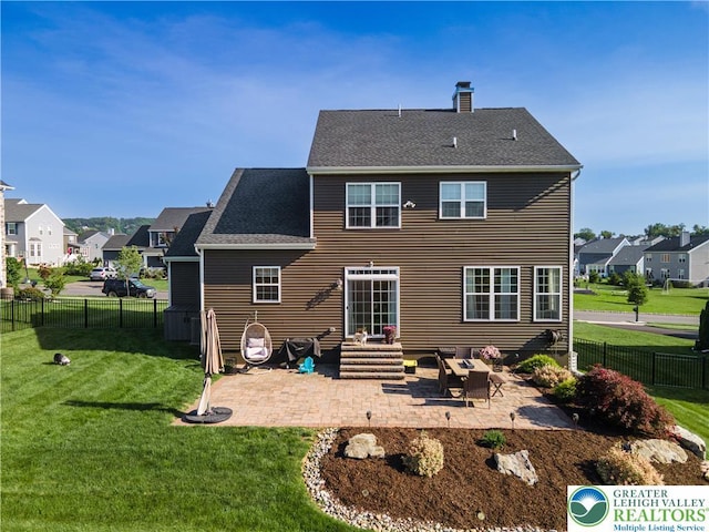 420 Rinaldi Ln, Forks Twp, PA 18040 - back of property with a patio, a chimney, a residential view, and a fenced backyard