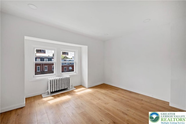 907 N 5th St, Allentown City, PA 18102 - spare room with radiator and light wood-style floors