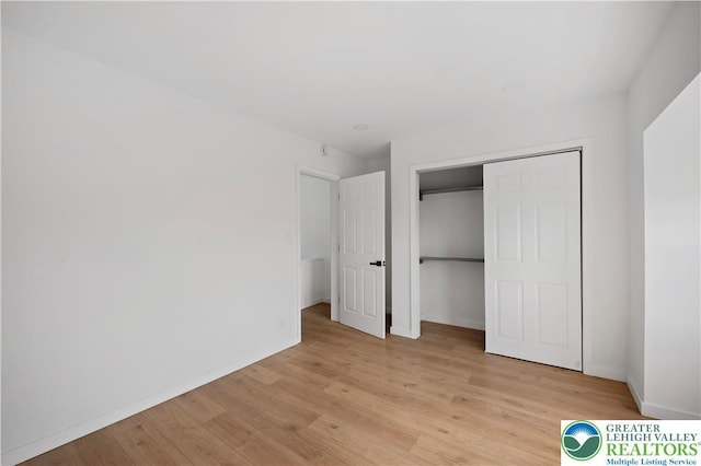 907 N 5th St, Allentown City, PA 18102 - unfurnished bedroom with light wood finished floors and a closet