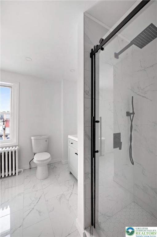 907 N 5th St, Allentown City, PA 18102 - full bathroom with radiator, a marble finish shower, marble look tile flooring, and vanity