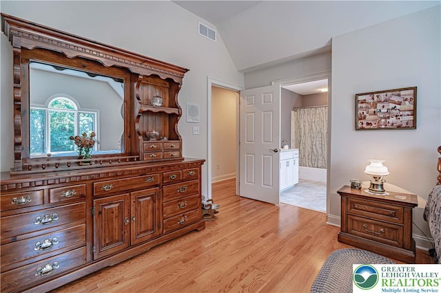 2650 Eagle Ln, Lower Saucon Twp, PA 18055 - bedroom featuring vaulted ceiling, light wood-style floors, and connected bathroom
