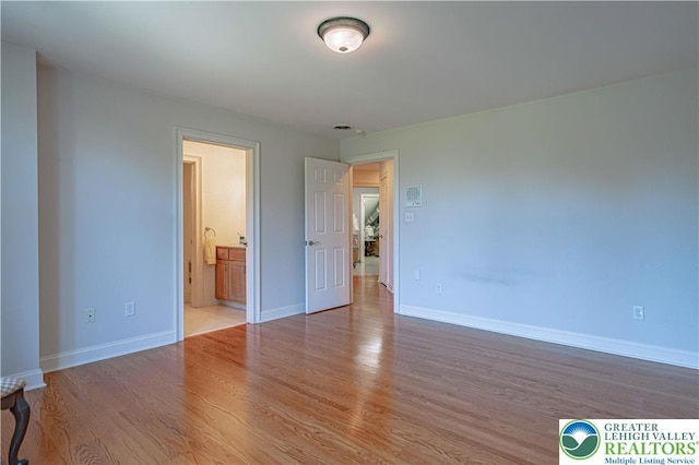 2650 Eagle Ln, Lower Saucon Twp, PA 18055 - unfurnished bedroom with wood finished floors and ensuite bath