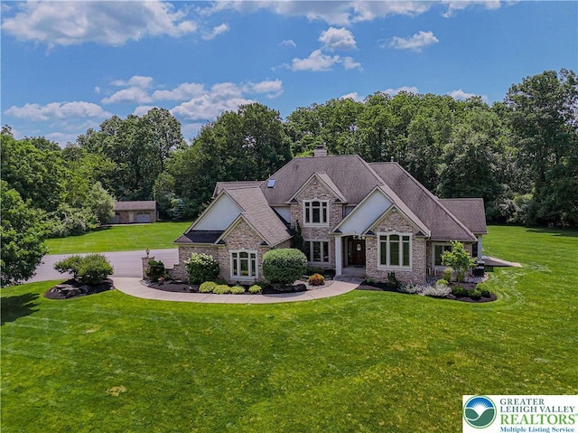 2650 Eagle Ln, Lower Saucon Twp, PA 18055 - craftsman inspired home with a front yard, a chimney, and stone siding