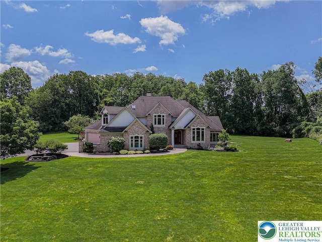 2650 Eagle Ln, Lower Saucon Twp, PA 18055 - view of front of house featuring a chimney, an attached garage, a front lawn, and driveway