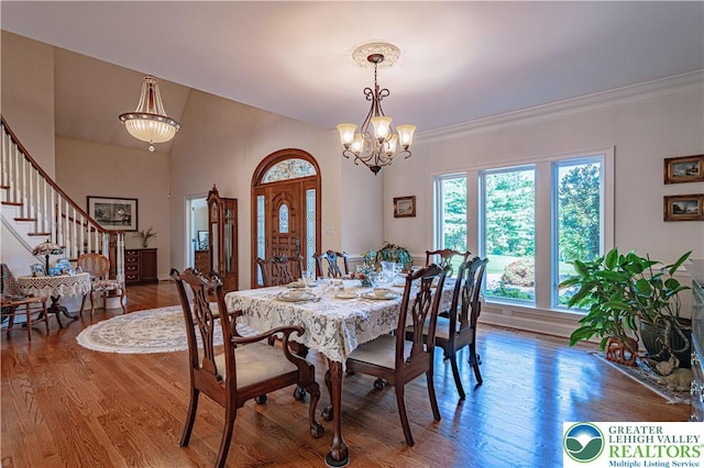 2650 Eagle Ln, Lower Saucon Twp, PA 18055 - dining room with stairway, wood finished floors, a chandelier, and ornamental molding