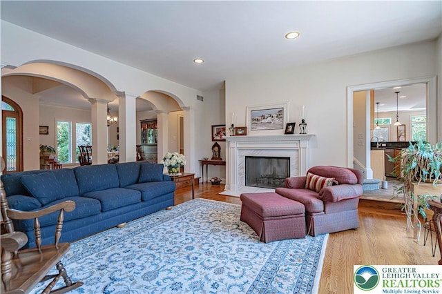 2650 Eagle Ln, Lower Saucon Twp, PA 18055 - living area featuring decorative columns, wood finished floors, healthy amount of natural light, recessed lighting, and a fireplace